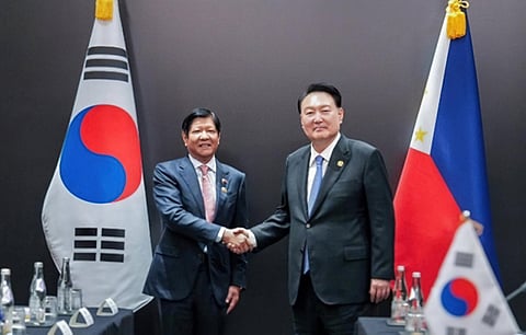 President Ferdinand ‘Bongbong’ Marcos Jr. (left) and South Korean President Yoon Suk Yeol congratulate each other after the signing of a landmark Free Trade Agreement on the sidelines of the 43rd ASEAN Summit in Jakarta, Indonesia.