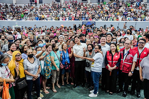 President Ferdinand R. Marcos Jr. oversees rice distribution at the Sports Complex in Manila on Tuesday. More than 1,000 beneficiaries of the 4Ps (Pantawid Pamilyang Pilipino Program) received a 25-kilogram sack of rice. | Photograph by Yummie Dingding for the Daily Tribune @tribunephl_yumi