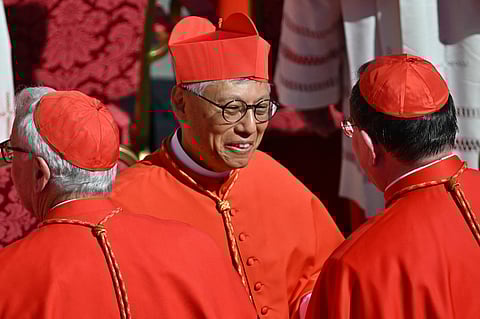 Newly elevated cardinal, Chinese bishop of Hong-Kong Stephen Chow Sau-Yan, is congratulated by fellow cardinals during a consistory for the creation of 21 new cardinals at St Peter's square in The Vatican on 30 September 2023. Pope Francis elevates 21 clergymen from all corners of the world to the rank of cardinal -- most of whom may one day cast ballots to elect his successor. (Photo by Filippo MONTEFORTE / AFP)