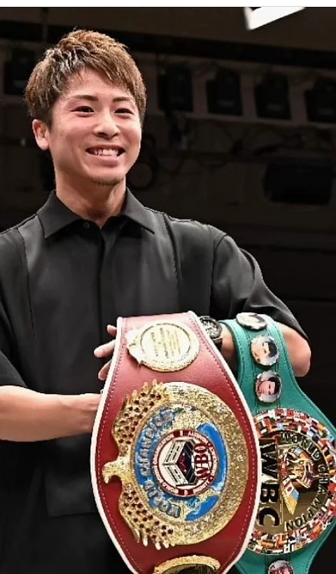 Naoya Inoue beams with pride after formally receiving the World Boxing Council and World Boxing Organization super-bantamweight title belts he plans to dangle against Filipino Marlon Tapales, holder of the World Boxing Association and International Boxing Federation belts. | PHOTOGRAPH COURTESY OF Naoki Fukuda