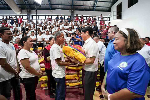 (FILES) President Ferdinand R. Marcos Jr. ensures that no one goes hungry as he personally oversees the distribution of food stamps and 25-kilo sack of rice to each 4Ps beneficiaries in Surigao del Norte on Friday.