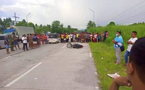 VILLAGE COUNCIL BET KILLED. Civilians and police authorities view the body of Tayan Mamalinta, a candidate for village council in Pandag, Maguindanao Sur, after he was ambushed by two motorcycle-riding gunmen in President Quirino town, Sultan Kudarat province on Tuesday (Sept. 12, 2023). Pursuit operations are ongoing against the suspects. (Photo courtesy of TJ Abpet)
