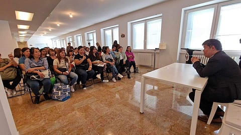 Department of Foreign Affairs Undersecretary for Migrant Worker’s Affairs Eduardo de Vega engages in a crucial meeting with Filipino illegal recruitment victims in Milan, Italy on Friday. DFA vowed to provide legal funding for their planned class action in court against the immigration consultancy firm Alpha Assistenza SRL, owned by couple Krizelle Respicio and Frederick Dutaro. | PHOTOGRAPH COURTESY OF office of DFA