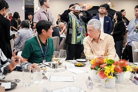 PRESIDENT Ferdinand Marcos Jr. (left) shares a meal with Singapore Prime Minister Lee Hsien Loong over the weekend on the sidelines of the F1 Grand Prix won by Team Ferrari. Marcos Jr. said he had ‘promising meetings’ with top Singaporean government officials. | PHOTOGRAPH COURTESY OF PCO