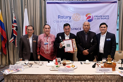 Rotary Club of Makati guest speaker, Profressor Francisco ‘Jay’ Bernardo III (center) during its membership meeting last 12 September stands, holding the Certificate of Appreciation handed over to him by the Club. With him in the photo are (from left) Rotarians Junjun Dayrit and Boy Arteche, RC Makati president Bing Matoto, and RC Makati Director Neil Makasiar. | PHOTOGRAPHS COURTESY OF Rotary Club of Makati