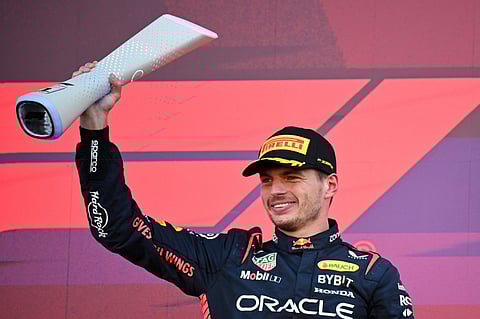 FILE PHOTO: Winner Red Bull Racing's Dutch driver Max Verstappen celebrates on the podium at the end of the Formula One Japanese Grand Prix at the Suzuka circuit, Mie prefecture on 24 September 2023. (Photo by Peter PARKS / AFP)