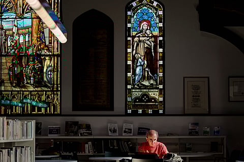 People visit the Mordecai-Richler Library built in a repurposed church in the Mile-End borough of Montreal on 26 September 2023. (Photo by ANDREJ IVANOV / AFP)