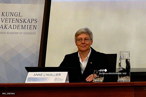 (FILES) Anne L'Huillier, then member of the Nobel Committee for Physics, sits in front of a screen displaying the winners of the Nobel Prize in Physics 2015 during a press conference of the Nobel Committee to announce the winner of the 2015 Nobel Prize in Physics on October 6, 2015 at the Swedish Academy of Sciences in Stockholm, Sweden. Research into light, new materials and cosmic exploration are seen as possible contenders for the Nobel Physics Prize on October 3, 2023, though experts warn it is difficult to predict a winner in the vast field. (Photo by Jonathan NACKSTRAND / AFP)