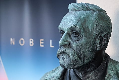 FILE PHOTO: A statue of Alfred Nobel is pictured ahead a press conference to announce the winner of the 2022 Nobel Prize in Physiology or Medicine in Stockholm, Sweden, on 3 October 2022. On Monday, 2 October 2023, a week of announcements of the Nobel Prize will kick off. (Photo by Jonathan NACKSTRAND / AFP)