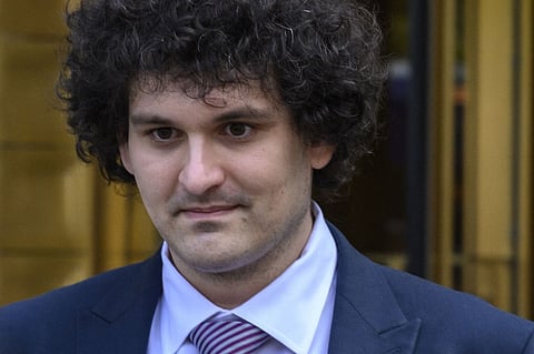 FILE PHOTO: Former FTX chief Sam Bankman-Fried leaves the Federal Courthouse following a bail hearing ahead of his October trial, in New York City on 26 July 2023. (Photo by ANGELA WEISS / AFP)