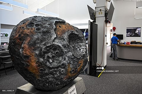 A model of the metal-rich asteroid named Psyche is displayed at the media center in NASA's Kennedy Space Center in Cape Canaveral, Florida, on October 10, 2023. NASA and SpaceX are targeting October 12, 2023, at 10:16 a.m. EDT for launch of the Psyche mission from Kennedy Space Center to the main asteroid belt between Mars and Jupiter. (Photo by CHANDAN KHANNA / AFP)