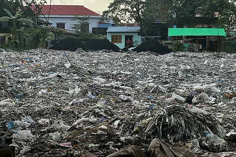 This photo taken on October 11, 2023 shows plastic waste in Yangons Shwepyithar township. In a working-class neighbourhood of Myanmar's Yangon, plastic waste is piled a metre high, the toxic product of what a recent investigation says is rampant dumping of Western trash. Photo by AFP