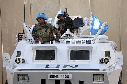 Peacekeepers of the United Nations Interim Force in Lebanon man their armoured vehicle in Lebanon's southern town of Naqoura near the border with Israel, on 15 October 2023. (Photo by AFP)