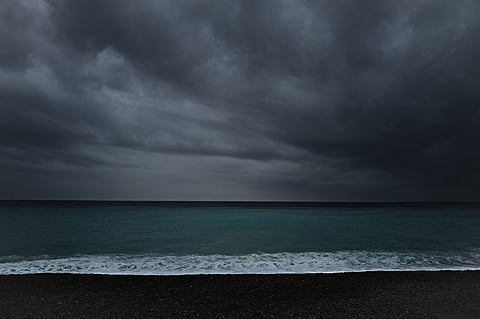 This photograph taken on 19 October 2023 shows clouds over the Mediterranean sea in the French riviera city of Nice. (Photo by Valery HACHE / AFP)