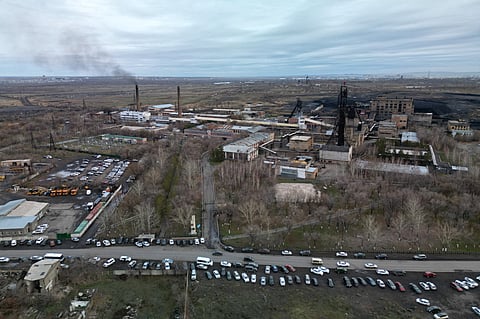 This photograph taken on 28 October 2023, shows a view of the Kostyenko ArcelorMittal coal mine in Karaganda, north-western Kazachstan. The death toll from a fire at a mine owned by ArcelorMittal in Kazakhstan rose to 32 people on 28 October 2023, with searches underway for 14 miners still missing, the country's emergency services said. (Photo by STRINGER / AFP)