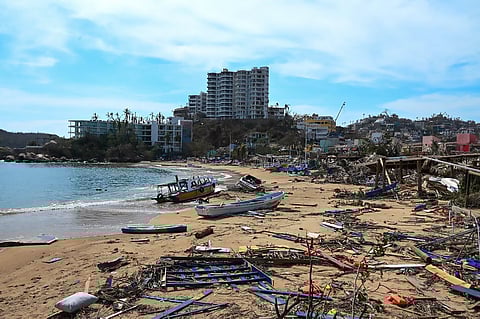 View of damages in the beach area following the passage of Hurricane Otis in Acapulco, Guerrero State, Mexico, on 26 October 2023. Hurricane Otis killed at least 27 people as it lashed Mexico's beach resort city of Acapulco as a scale-topping category 5 storm, officials said Thursday, in what residents called a "total disaster."(Photo by FRANCISCO ROBLES / AFP)
