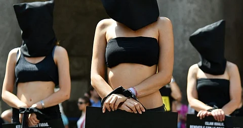FILE PHOTO: Amnesty International activists perform a flash mob on 13 July 2016, in Rome's Pantheon square to remember late Italian student Giulio Regeni and other victims following their last report. The badly mutilated body of Regeni, a 28-year-old Cambridge University PhD student, was found out on 4 February 2016 in Cairo. Italian media and diplomats say he was killed by the security services but Egypt denies the claims. (Photo by VINCENZO PINTO / AFP)