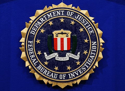 The Federal Bureau of Investigation (FBI) seal (Photo by Mandel NGAN / AFP)