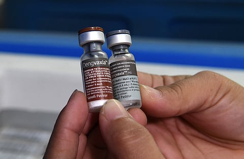 (FILE PHOTO) A medical worker displays vials of Sanofi's dengue vaccine Dengvaxia at a health center in the district of Manila on December 5, 2017, following the suspension of the country's public dengue immunisation programme.
Philippines has suspended the sale and distribution of Sanofi's dengue vaccine, authorities said on December 5, after the French pharmaceutical giant last week warned it could worsen symptoms for people who had not previously been infected. / AFP PHOTO / Ted ALJIBE (Photo credit should read TED ALJIBE/AFP/Getty Images)