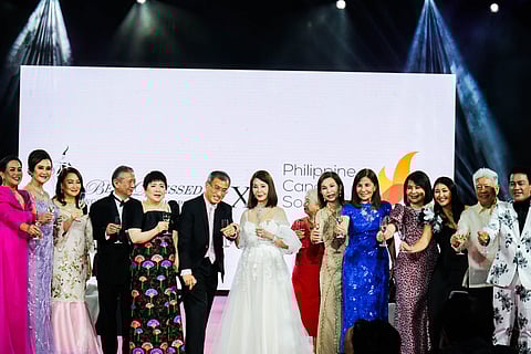 ANGOLA Consul Helen Ong (seventh from left) with the Board of Trustees and officers of the Philippine Cancer Society (from left) Maymay Liechtenstein, Dr. Mildred Vitangcol, Flora Chua, Mario Katigbak, Consul Betty Chua, Dr. kelly Salvador, Dr. Corazon Ngelangel, Dr. Rachael Rosario, Eisa Paredes Mercado, Consul Marian Ong, Sheree Chua, Charlie Rufino and Bo Muralla.