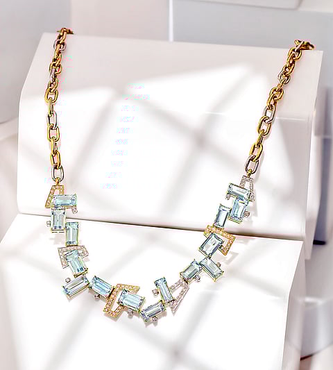 gemstones that are meticulously selected to enhance the asymmetrical narrative.