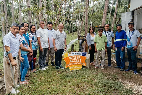 Representatives from One Meralco Foundation, the local government and Barangay Sibaltan gather for the switch-on of Acosta Water Pumping Station.