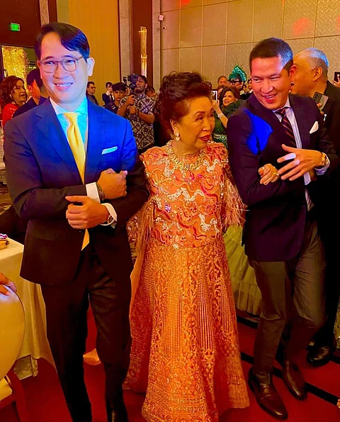 Lydia Reyes with sons Gene and Arnold Reyes.