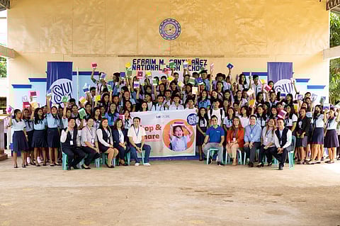 SM Store CSR senior manager Aries Pineda and SM Store Iloilo branch manager Yvonnie Delgado brought hundreds of school kits to Efraim M. Santibanez National High School, an SM Foundation Inc. partner school in Passi, Iloilo.
