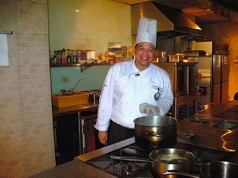 Steve Villacin cooking up a storm in the kitchen.