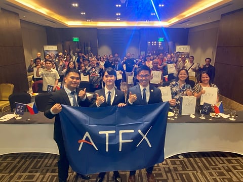 Empowering Filipino traders at the recent BOSS event: SmarTrade Market Analyst Gab Santos and ATFX Business Development Managers in Southeast Asia Jabez Kot and Jason Tee.