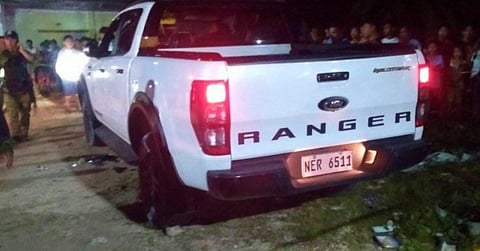 Police cordoned off the pickup truck of Saudi national Solayman Jamal and his wife after an ambush in Shariff Aguak, Maguindanao del Sur on Tuesday night (Oct. 10, 2023). Jamal died on the spot while his wife, Bainot Jamal, was wounded. (Photo courtesy of Shariff Aguak LGU)