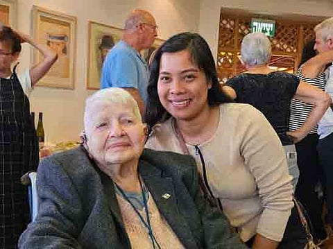 Filipina caregiver Camille Jesalva (right) is seen with her 95-year-old ward, Nitza Hefetz, celebrating her 95th birthday at the Nofim home for seniors in Jerusalem in this undated photo. Jesalva saved both her own life and Hefetz by offering the savings she had set aside for her upcoming trip to the Philippines to a Hamas terrorist who entered their residence along the Gaza border on 7 October. | PHOTOGRAPH COURTESY OF Camille Jesalva FACEBOOK PAGE
