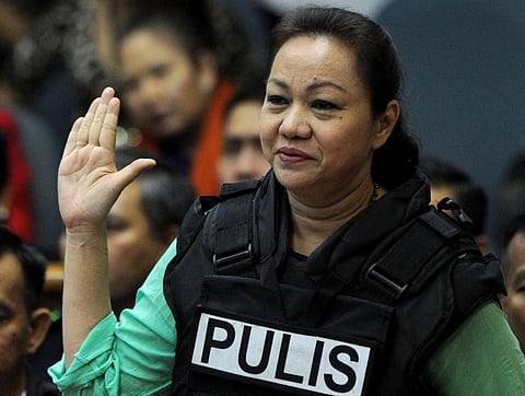 JANET Lim Napoles wears a flak jacket during a court hearing for her many pork barrel-related cases. The Sandiganbayan has cleared her in one plunder case, but convicted her of nine counts of corrupting a public official. | Jay DIRECTO/AGENCE FRANCE-PRESSE