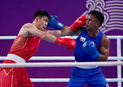 EUMIR Marcial battles Tanglatihan Tuohtaerbieke in the gold medal match of the men’s 80-kg event of the 19th Asian Games. Marcial lost via unanimous decision. 📸 POC-PSC MEDIA GROUP