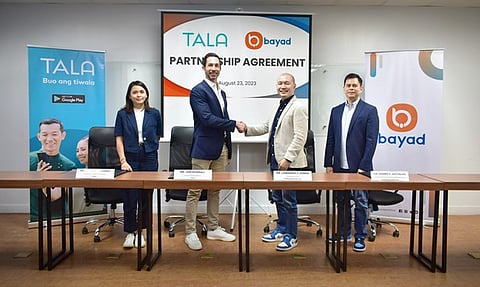 Executives of Bayad and Tala ink a partnership agreement. Seen in the photo (from L-R) are Tala President and Head of Finance Charisse Alvarez, Tala Chief Business Officer Jori Pearsall, Bayad President and CEO Lawrence Y. Ferrer, and Bayad Chief Commercial and Marketing Officer Dennis S. Gatuslao.
