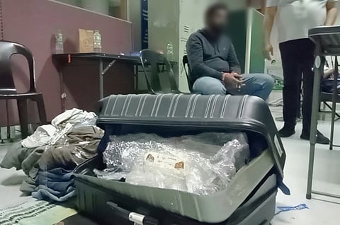 MOHAMMAD Afzal awaits processing at the Ninoy Aquino International Airport after shabu worth P25 million was found inside his luggage. | Photograph COURTESY OF BOC-NAIA