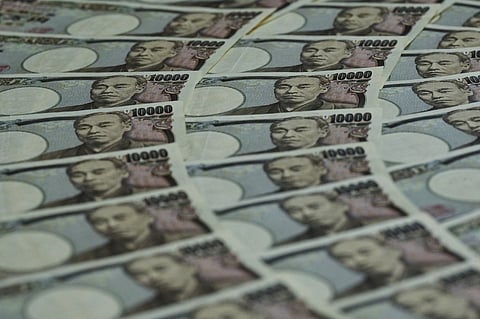 FILE PHOTO: This photo illustration taken on 24 September 2022 shows Japanese 10,000 yen notes on display in Tokyo. Japan's finance ministry. (Photo by Richard A. Brooks / AFP)