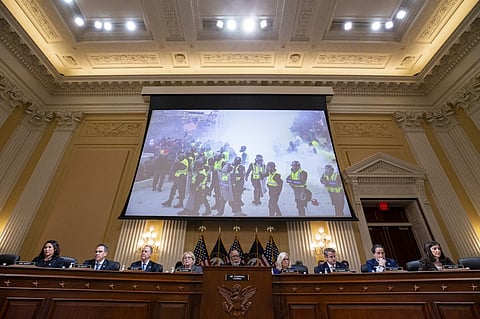 FILE PHOTO: US Capitol police and rioters are displayed on a screen during the final US House Select Committee hearing to Investigate the January 6 attack on the US Capitol, on Capitol Hill in Washington, DC, on 19 December 2022. (Photo by Al Drago / POOL / AFP)