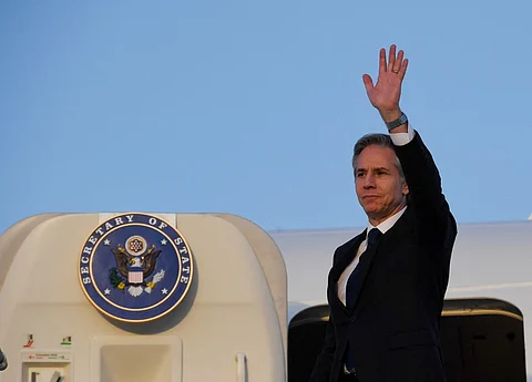 FILE PHOTO: US Secretary of State Antony Blinken boards his airplane. (Photo by OLIVIER DOULIERY / POOL / AFP)