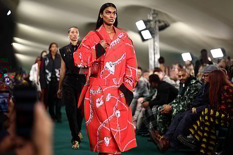 Models present creations during a catwalk presentation for British fashion house Burberry's Spring/Summer 2024 collection, at London Fashion Week in London, on 18 September 2023. (Photo by HENRY NICHOLLS / AFP)