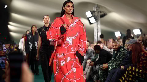 Models present creations during a catwalk presentation for British fashion house Burberry's Spring/Summer 2024 collection, at London Fashion Week in London, on 18 September 2023. (Photo by HENRY NICHOLLS / AFP)