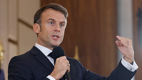 (FILES) France's President Emmanuel Macron addresses a speech as he meets with students of Kazakhstan at Astana University in Astana on 1 November 2023. French President arrived in Central Asia on 1 November, aiming to boost France's profile in a region where Russia, China, Turkey, and Europe are all jostling for influence. (Photo by Ludovic MARIN / AFP)