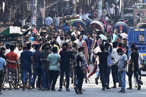 Garment workers block a road during a protest demanding the increase of their salaries, in Dhaka on 2 November 2023. (Photo by Munir uz ZAMAN / AFP)