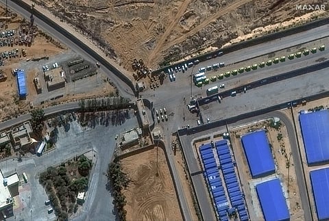 This handout satellite image courtesy of Maxar Technologies shows an overview of Rafah border crossing between Egypt and Gaza Strip on 7 November 2023. (Photo by Satellite image ©2023 Maxar Technologies / AFP)