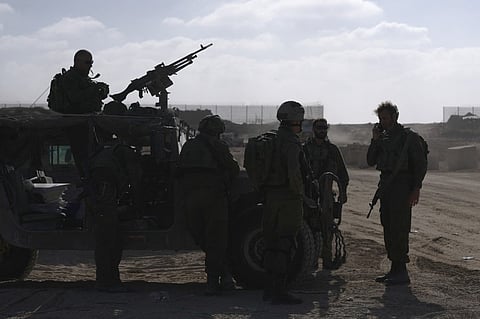 Israeli troops are pictured near the border fence between Israel and the Gaza Strip ahead of an operation in the north of the Palestinian enclave on November 8, 2023, amid continuing battles between Israel and the Palestinian militant group Hamas. (Photo by Daphné LEMELIN / AFP)