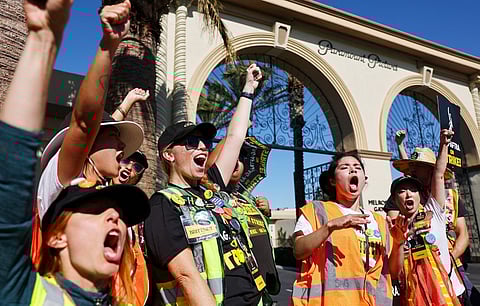 LOS ANGELES, CALIFORNIA - NOVEMBER 08: SAG-AFTRA members chant outside Paramount Studios on day 118 of their strike against the Hollywood studios on November 8, 2023 in Los Angeles, California. A tentative labor agreement has been reached between the actors union and the Alliance of Motion Picture and Television Producers (AMPTP) with the strike set to end after midnight. Mario Tama/Getty Images/AFP.
