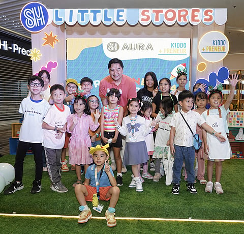 SM Engineering Design and Development President Hans "Chico" Sy, Jr. (center) stands proudly alongside the young business owners.