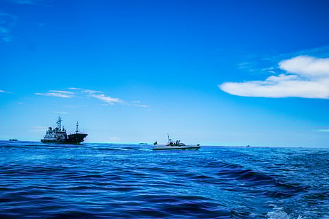 A China Coast Guard rubber boat draws near Philippine Coast Guard rhib boats as it transports journalists covering the RORE mission to BRP Sierra Madre in Ayungin Shoal on Friday, 10 November 2023. | 📷 Yummie Dingding