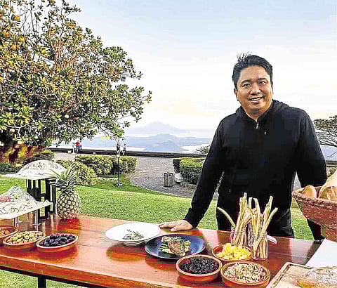 CHEF Jayme Natividad in front of the picturesque backdrop of Taal Volcano.
(Photograph courtesy of Jayme Natividad.)