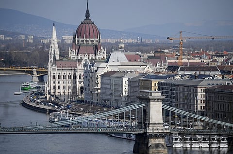 (FILES) The bank of the Danube River with the oldest Hungarian Bridge, the 'Lanchid' (Chain Bridge) and the parliament building in Budapest. A party tram, exhibitions and other events will take center stage in Hungary's capital Budapest, a vibrant metropolis which marks its 150th birthday on 17 November 2023. (Photo by ATTILA KISBENEDEK / AFP)